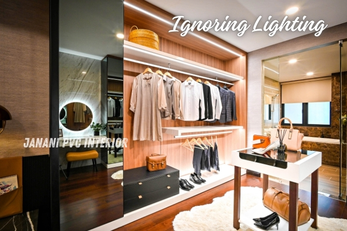 Chic walk-in closet in Bengaluru featuring expertly integrated lighting by Maran PVCInterior, enhancing the visibility and ambiance of the space while showcasing a sleek and organized wardrobe setup
