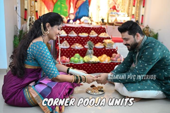 Indian couple performing a traditional pooja in a corner unit designed by Maran PVCInterior in Bengaluru, showcasing a vibrant and cultural setting perfect for family rituals and celebrations